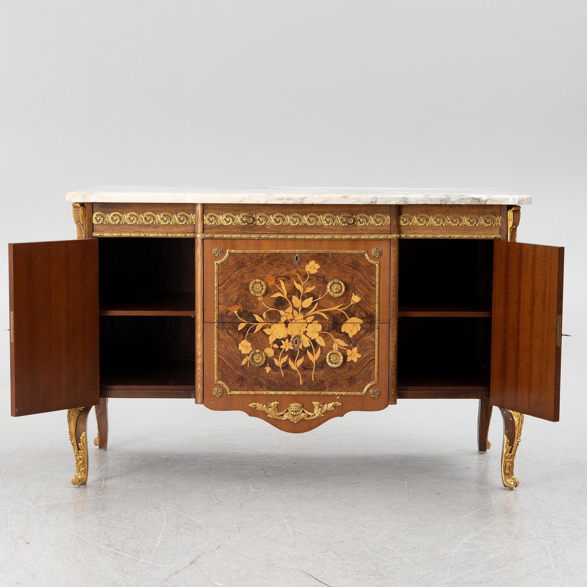 A chest of drawers, Louis XVI style, mid 20th Century.