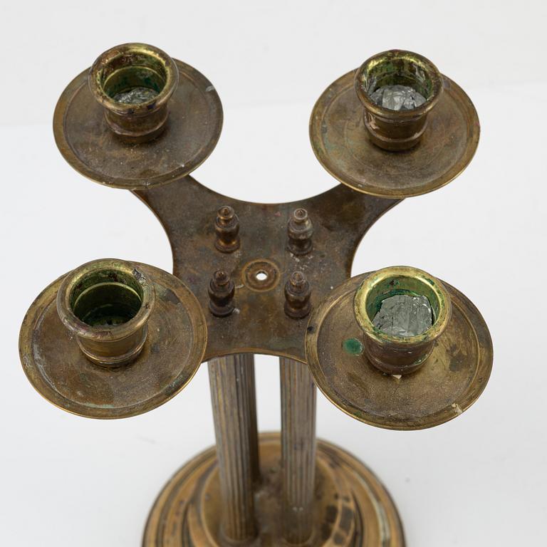 A pair of brass candelabras, first half of the 20th century.
