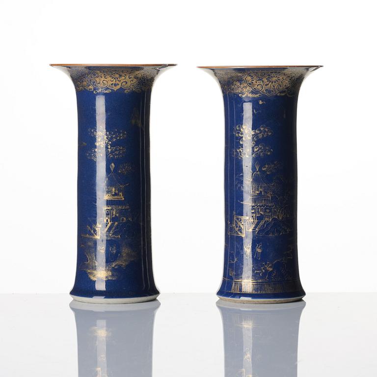 A pair of powder blue and gold 'trumpet' vases, Qing dynasty, 18th century.