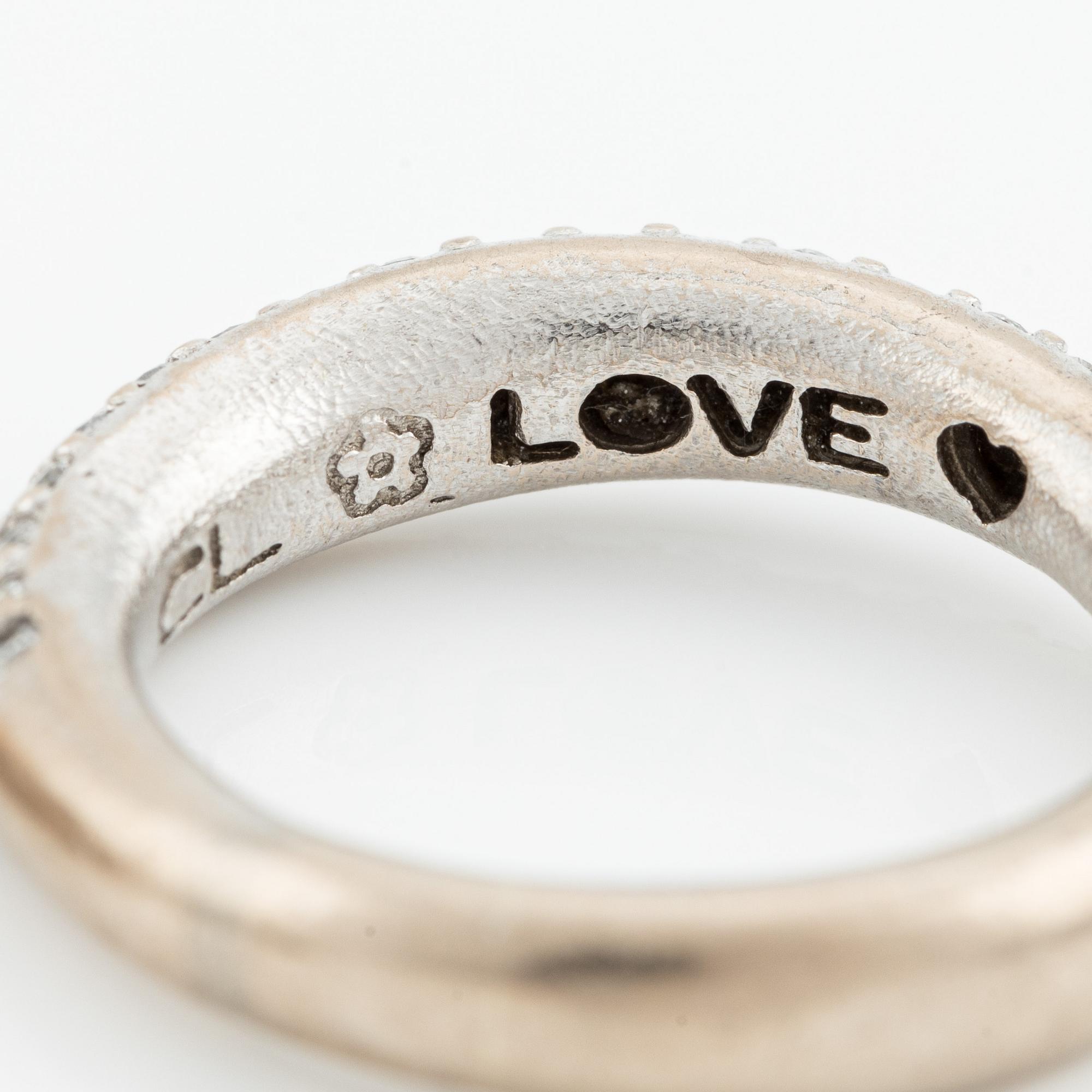Ole Lynggaard two "Love" rings no. 4 in 18K white gold with round brilliant-cut diamonds.