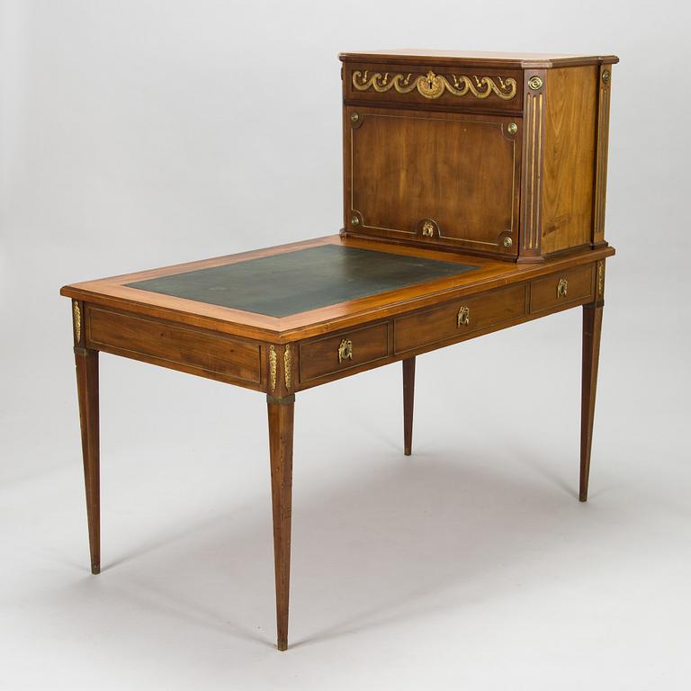 A 20th-century Louis XVI style mahogany veneered writing desk.