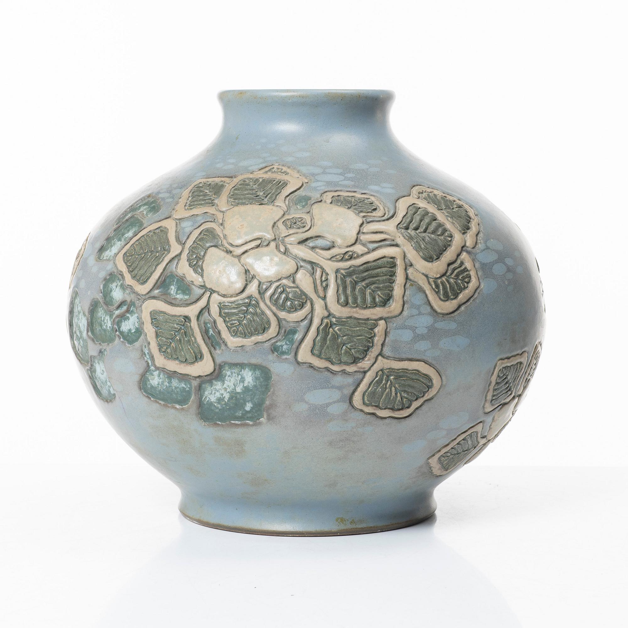 A blue glazed relief vase, possibly Korea, around 1900.