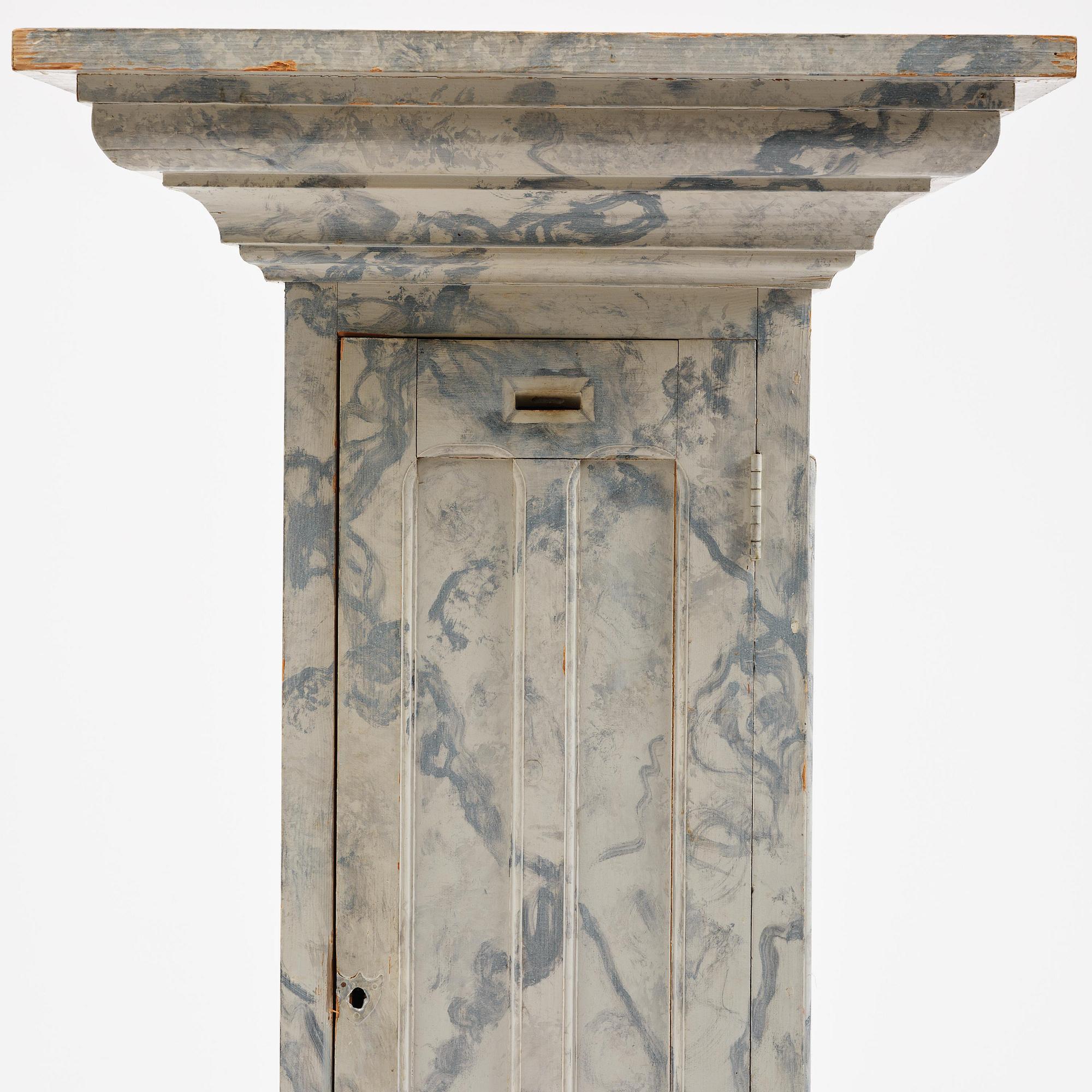 A Swedish column-shaped cabinet late 19 th century.