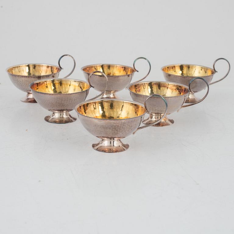 nine silver punsch mugs, Fritz Olsson AB and Ceson, Sweden, 1961, also two silver cups and two silver boxes.