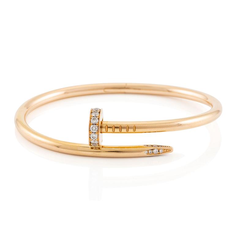 A Cartier bracelet "Juste un clou" in 18K rose gold with round brilliant-cut diamonds.