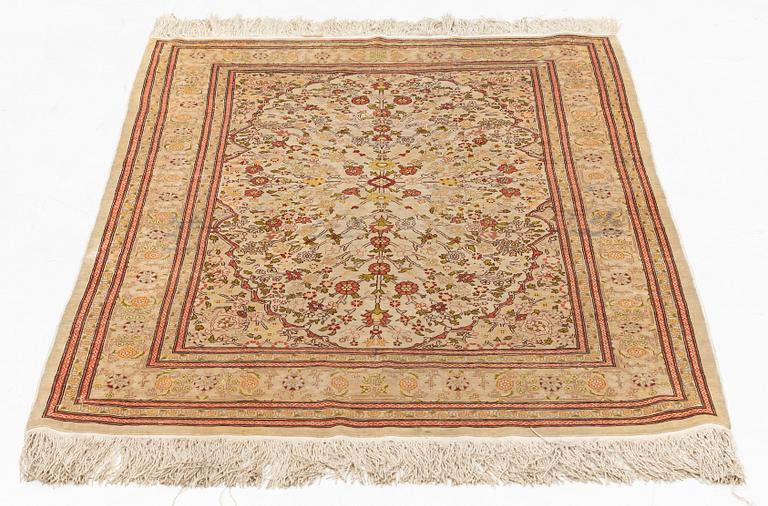 A Hereke silk rug, c. 130 x 87 cm.
