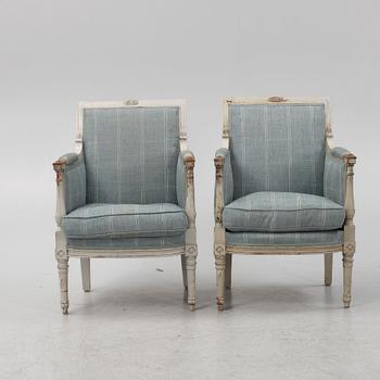 A painted pair of Bergere armchairs, France, 19th Century.