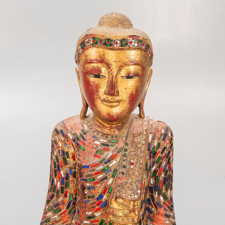 A gilde wooden Buddha first half of the 20th century.