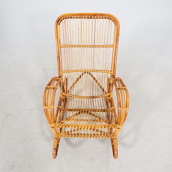 A bamboo and rattan mid 1900s rocking chair.