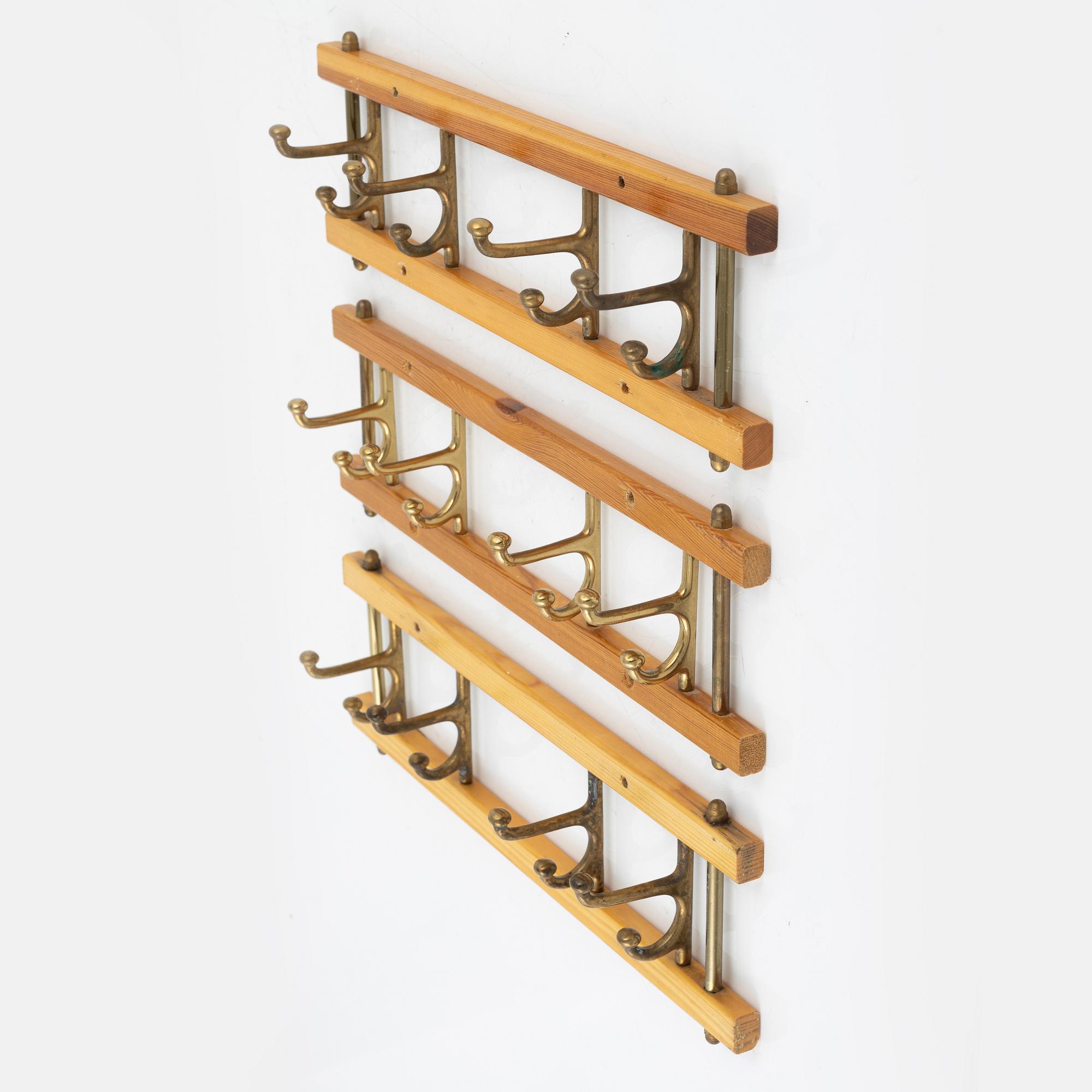 A group of three 'Dekorativ' coat hangers, Skoglunds metallgjuteri, Anderstorp, 1950's/60's.