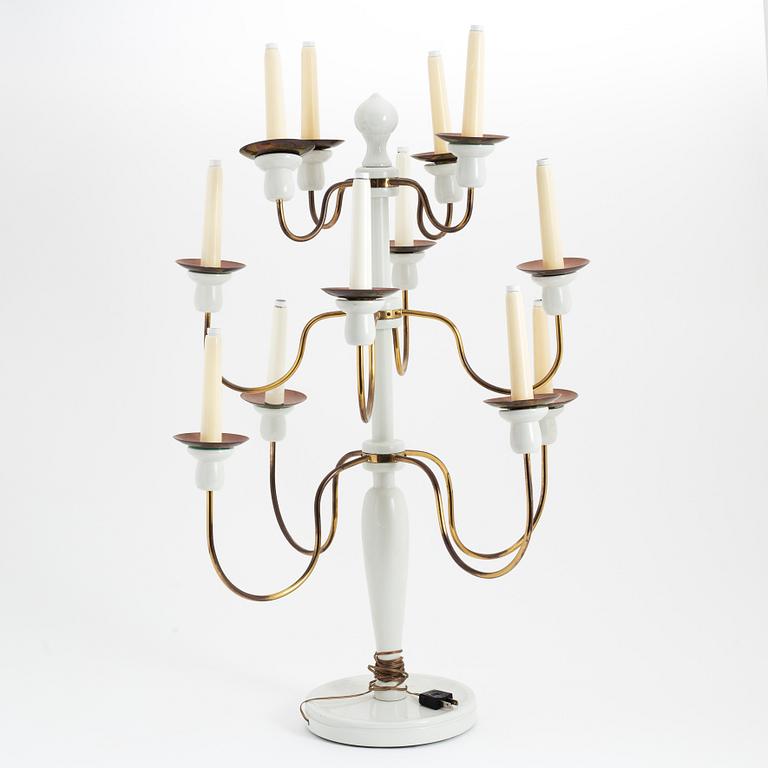 A painted wood and brass model 2586 candelabra by Josef Frank for Firma Svenskt Tenn.