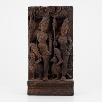 A carved wooden relief, presumably India, 20th century.