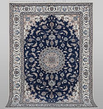 A carpet, Nain, part silk, ca 294 x 198 cm.