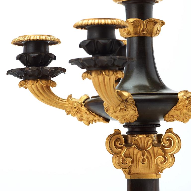 A pair of French 1830/1840's late Empire six-light candelabra.