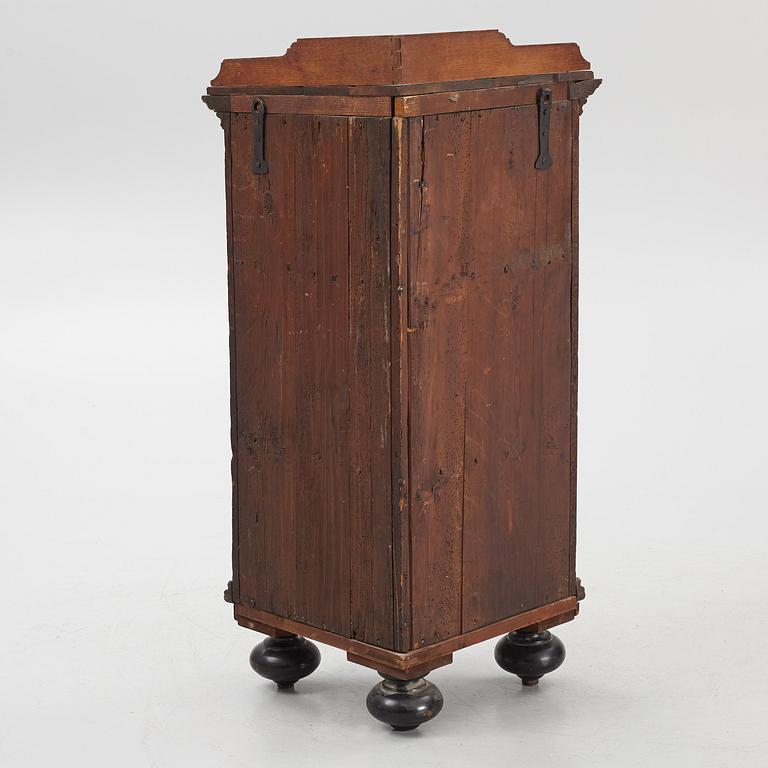 A Baroque corner cabinet, 18th Century.