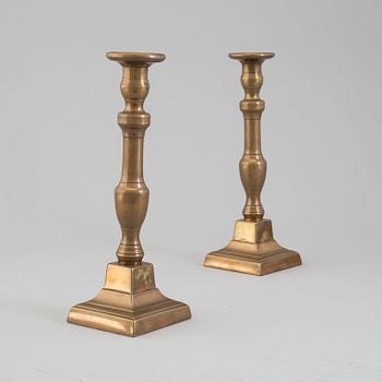 A pair of 19th century bronze candlesticks.