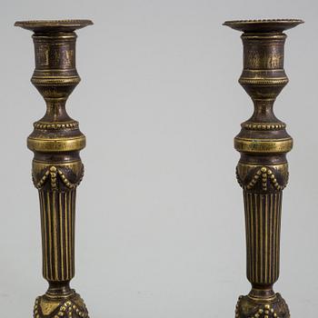 A PAIR OF BRONZE GUSTAVIAN CANDLESTICKS, 18th century.