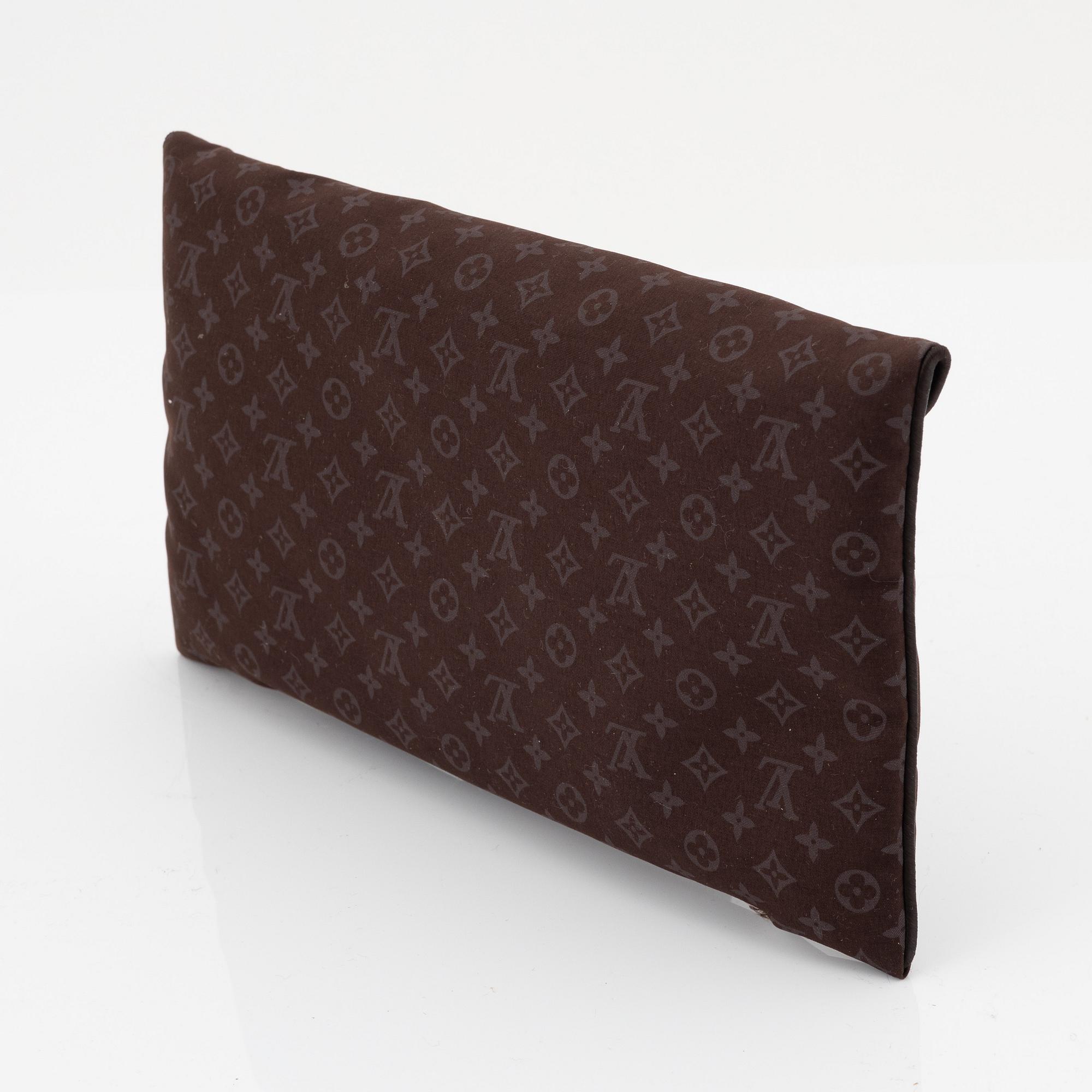 Louis Vuitton, a monogram "Trousse kit de voyage' travel kit with inflatible pillow and eye mask.