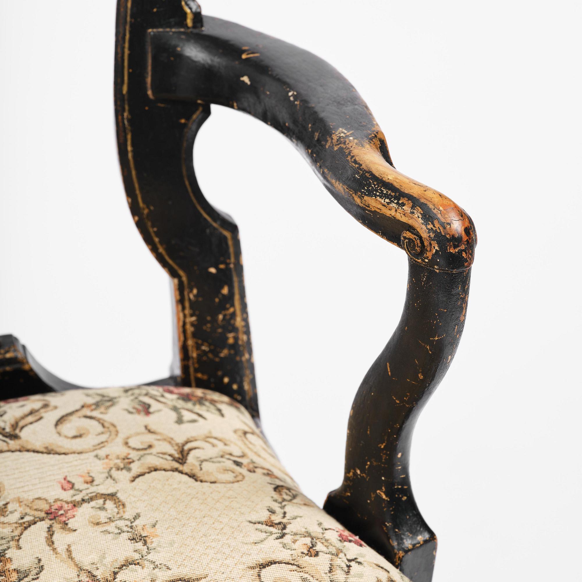 A pair of rococo armchairs in the manner of C. M. Sandberg, later part 18th century.