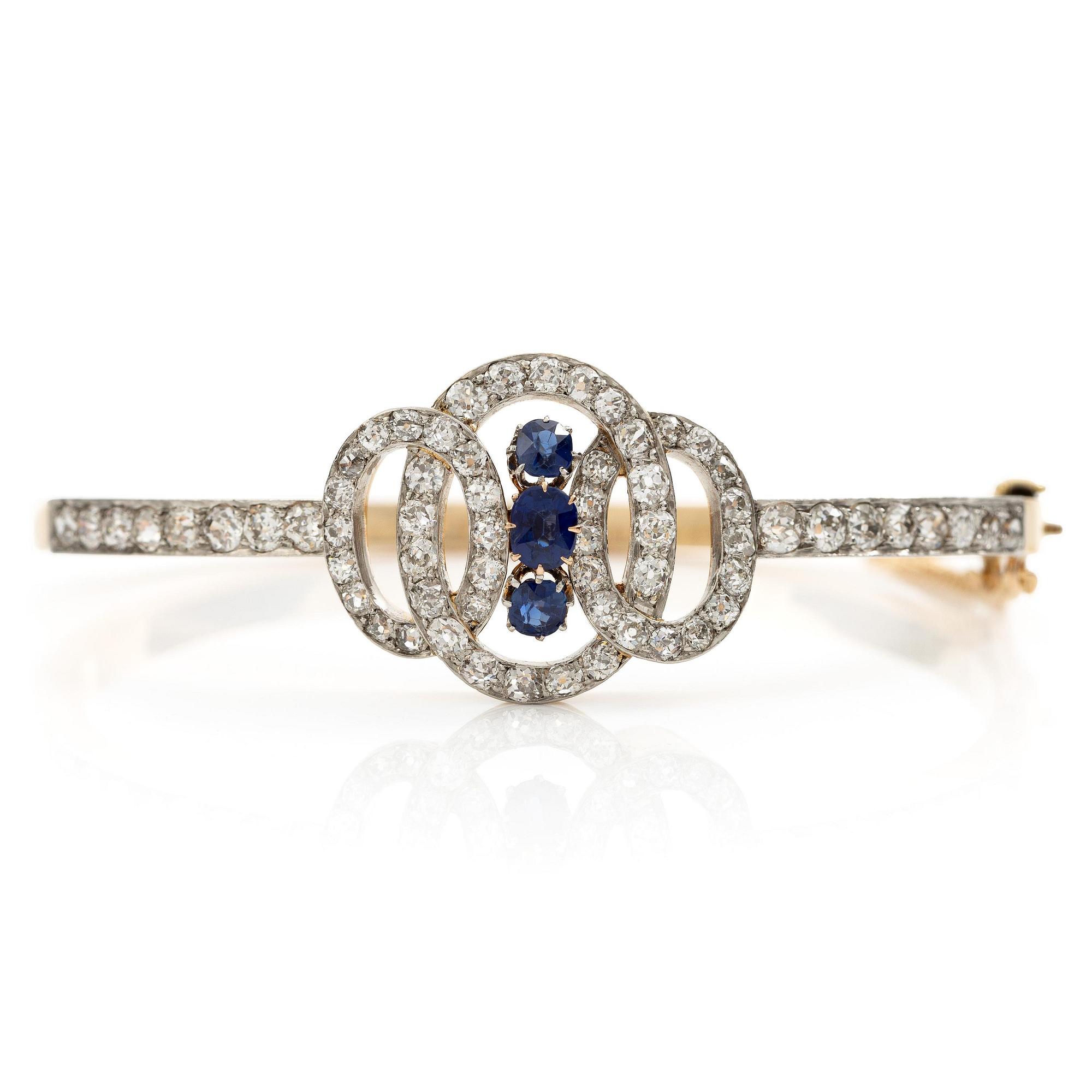 A bracelet in 18K gold and platinum set with old-cut diamonds and faceted sapphires.