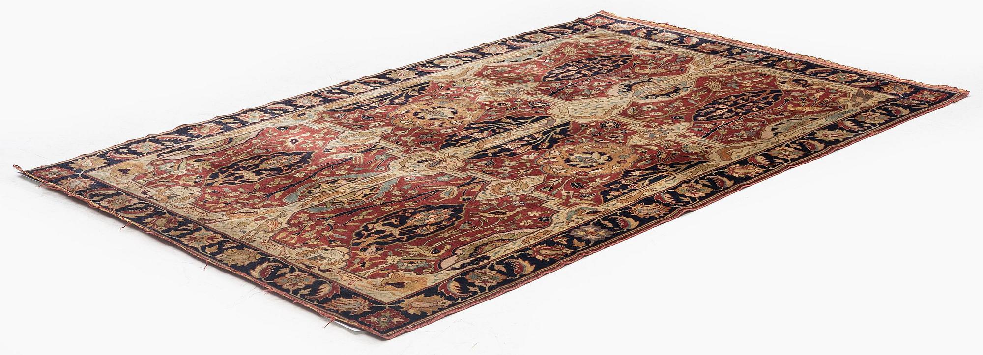 An antique Anatolian silk rug, c. 183 x 120 cm.