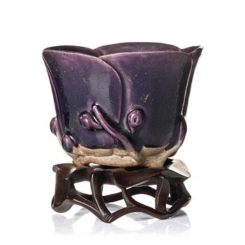 995. An aubergine glazed lotus cup, Qing dynasty, Kangxi (1662-1722).