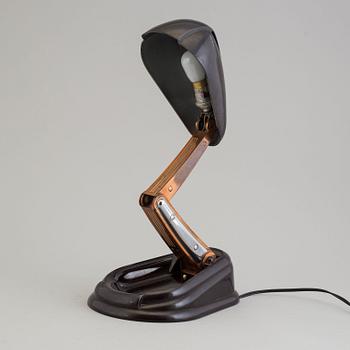 a bakelite and metal table 'Bolide' table lamp, by JUMO, 1940's.