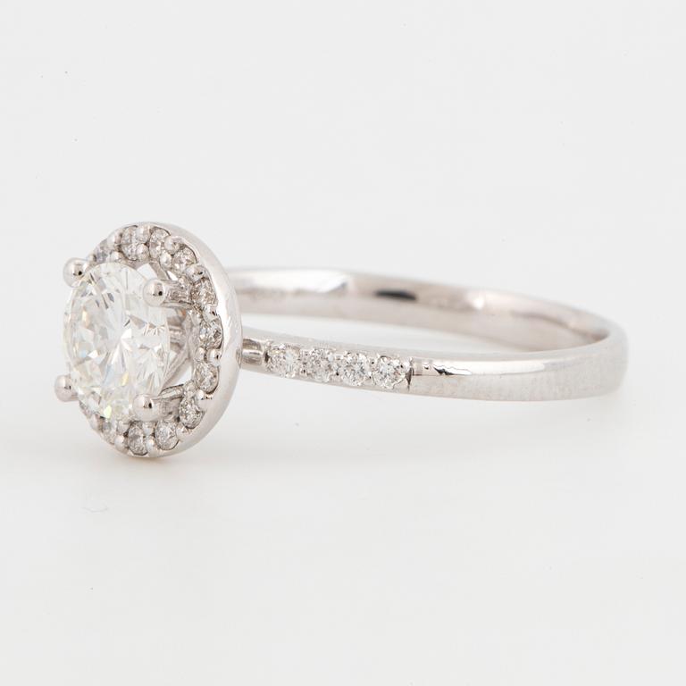 Brilliant-cut diamond halo ring.