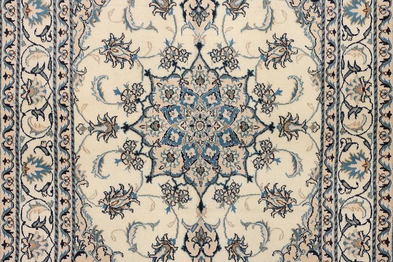 A Nain part silk rug, c. 193 x 148 cm.