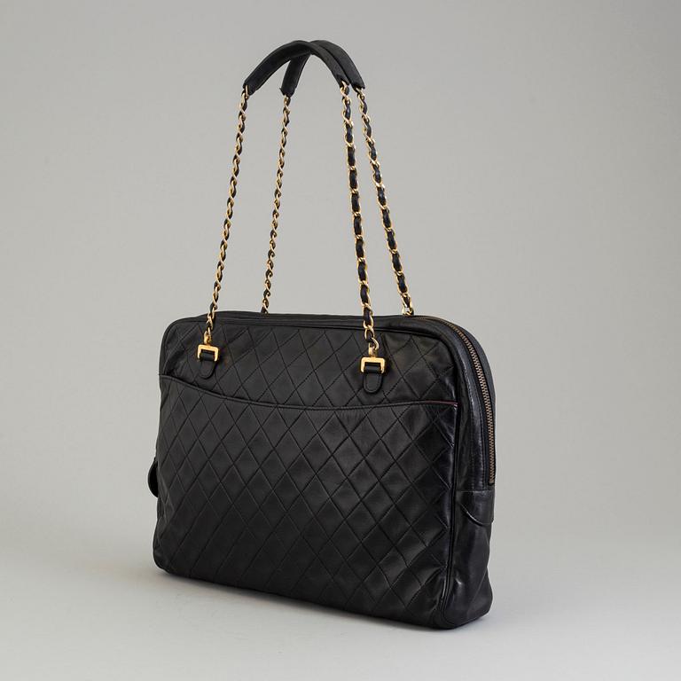 a CHANEL black leather bag.