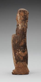 A painted pottery figure of a standing female, Tang dynasty (618-907).