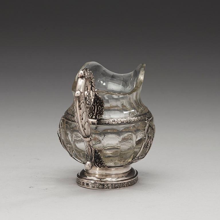 A Russian 19th century glass and silver cream-jug, unidentified makers mark, St. Petersburg 1834.