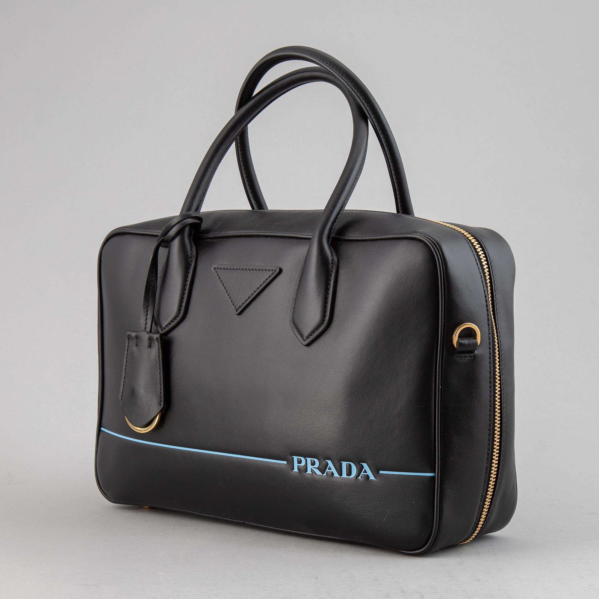PRADA, a leather bag.
