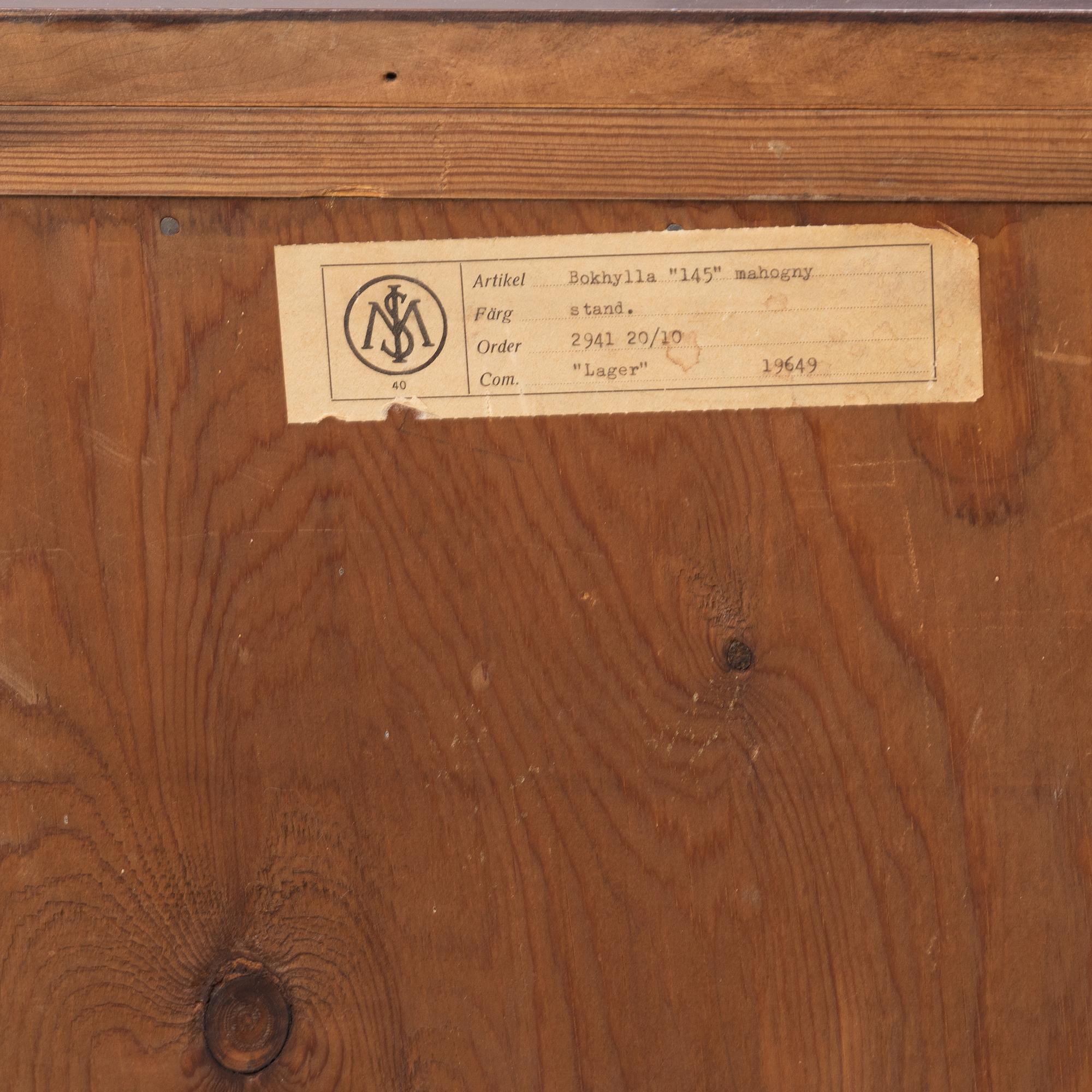 A mahogany-veneered bookcase, Axel Ståhls Möbelfabrik AB, Vimmerby, Sweden, mid 20th century.