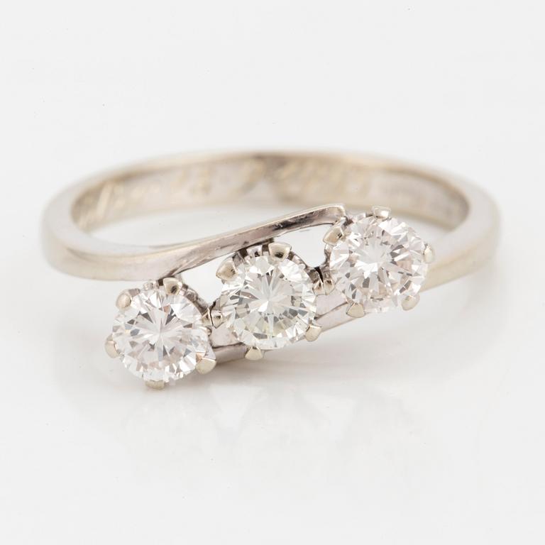 A three stone diamond ring.