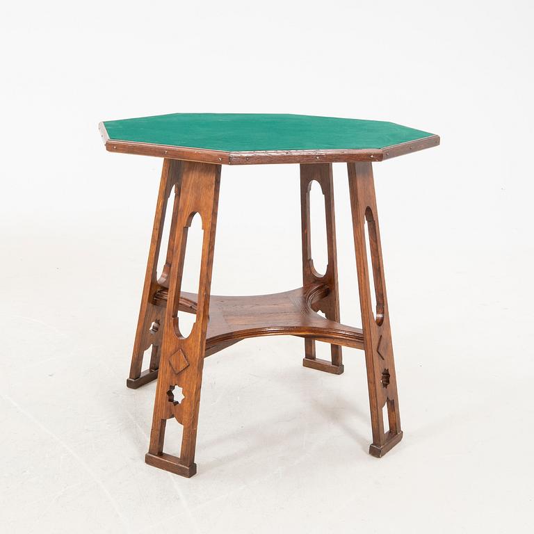 An early 1900s oak game table.