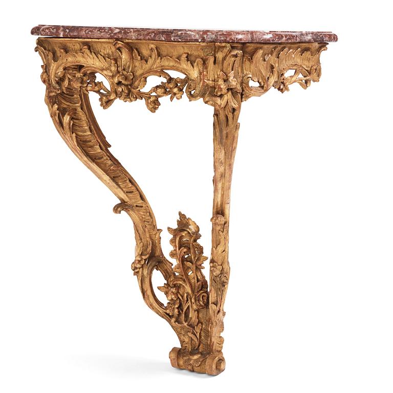 A Central European Louis XV carved and giltwood console table, mid 18th century.