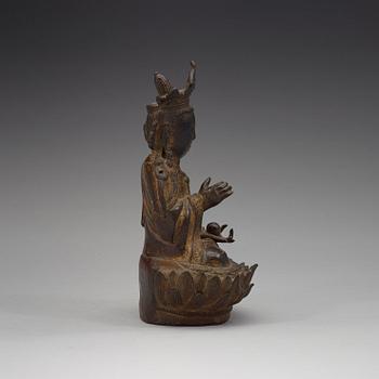 A bronze figure of Guanyin, late Ming dynasty (1368-1644).