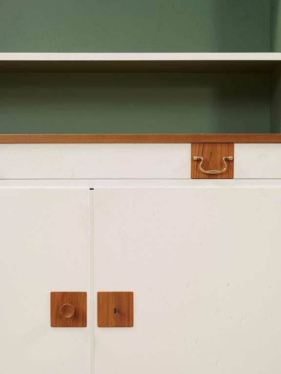 A Josef Frank set of five walnut and white lacquered bookshelves, Svenskt Tenn, model 2255.