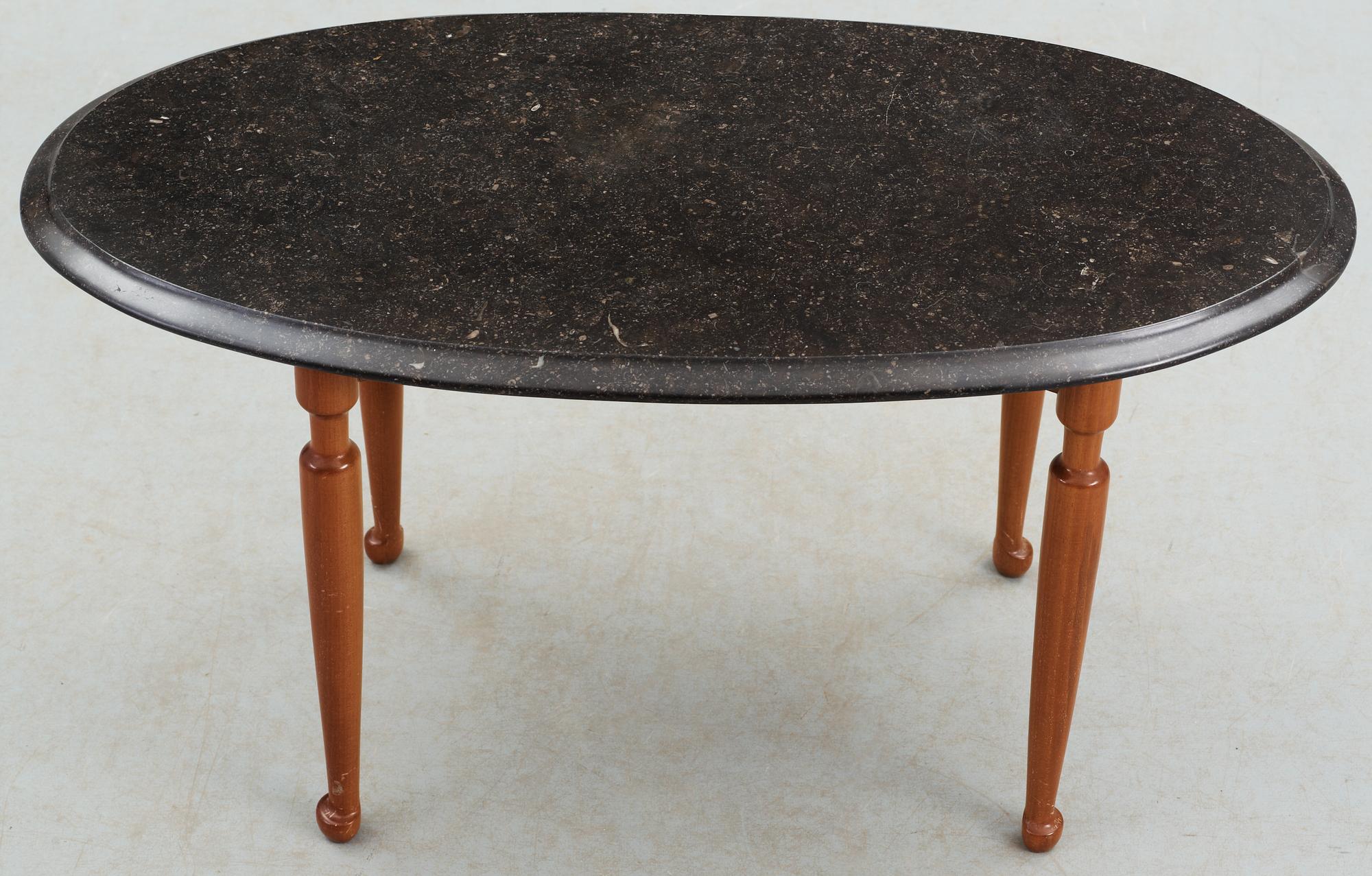 A Josef Frank black marble top and mahogany table by Svenskt Tenn.