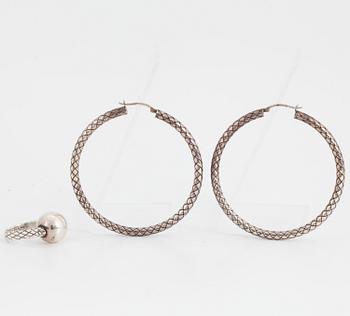 BOTTEGA VENETA, a pair of silver earrings and a silver ring.