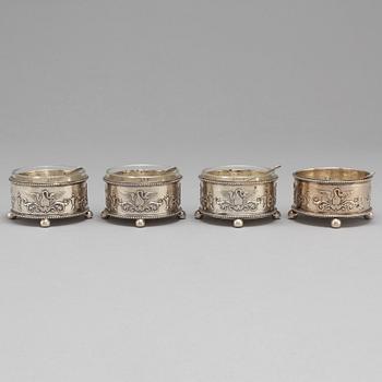 A set of four Fabergé salt-cellars and spoons, marked Moscow 1908-1917. Imperial Warrant.