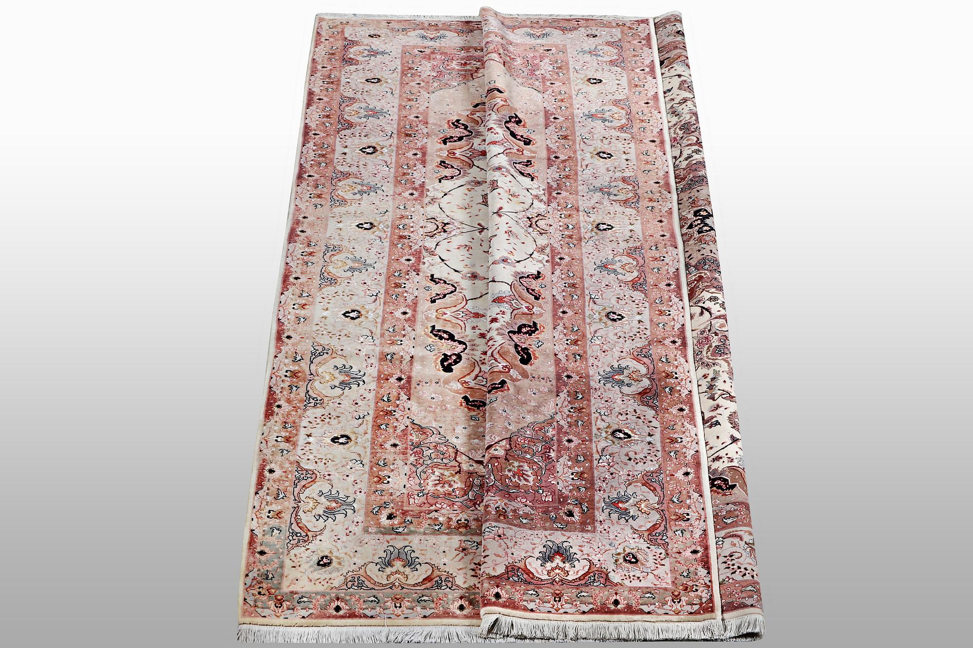A carpet, Tabriz, part silk, 50 Raj, ca 340 x 253 cm.
