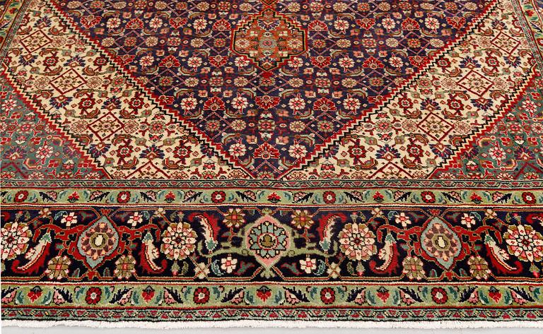 A Tabriz carpet, approximately 360 x 255 cm.