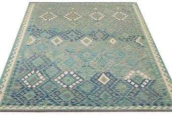 An Afghan kilim carpet, c. 299 x 213 cm.