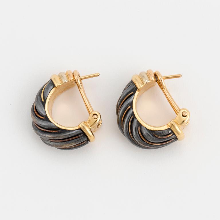 A pair of Cartier hoop earrings.