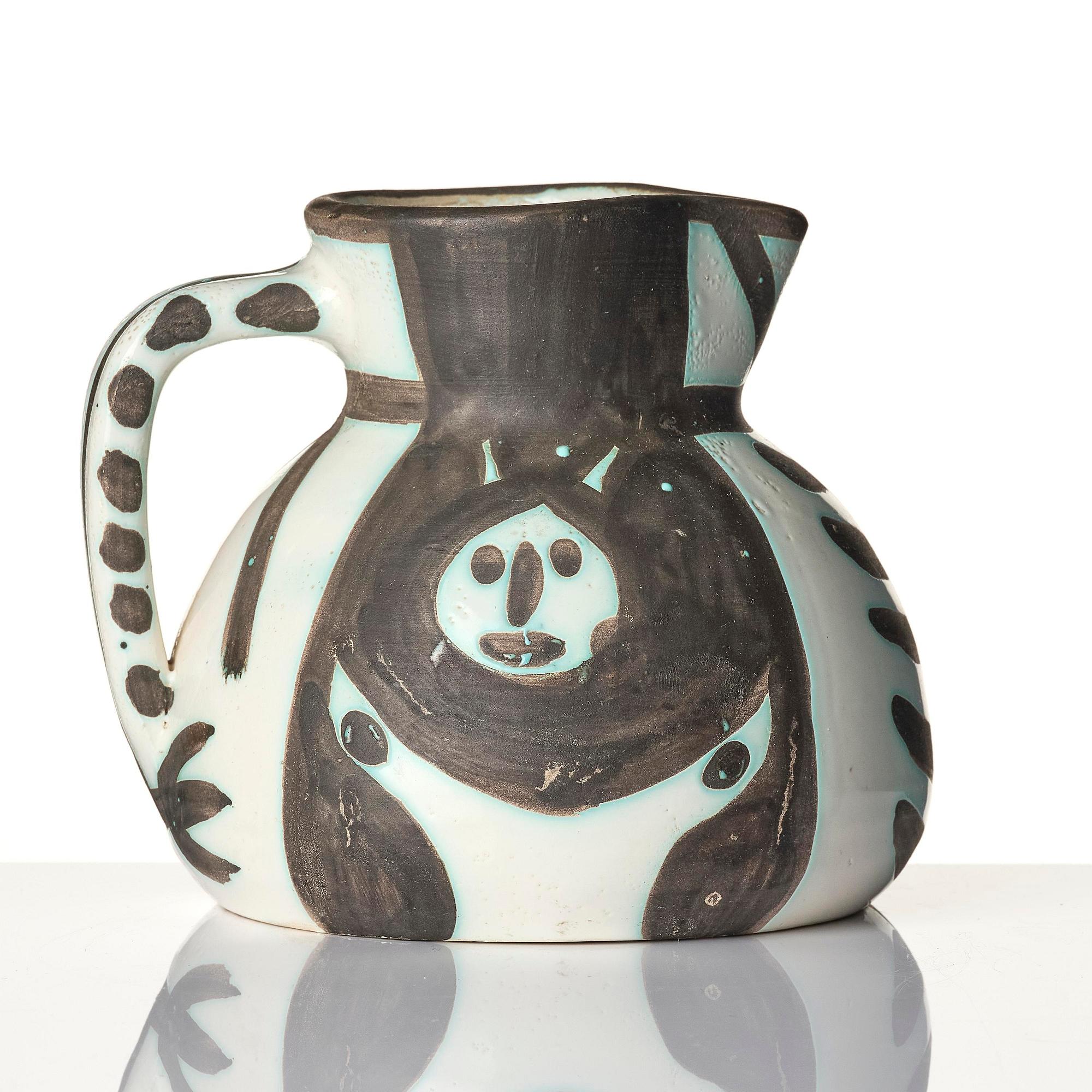 Pablo Picasso, a "Pichet petites têtes" (A.R. 222) faience pitcher, Madoura, Vallauris, France, post 1953.