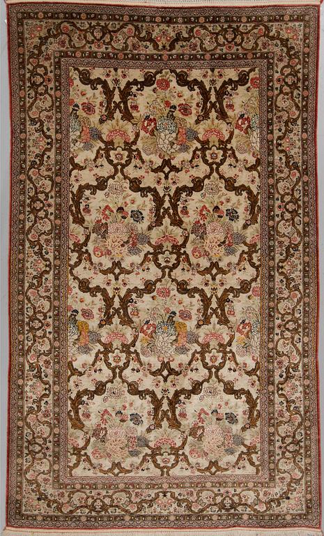 A silk Qum rug, around 220 x 134 cm.