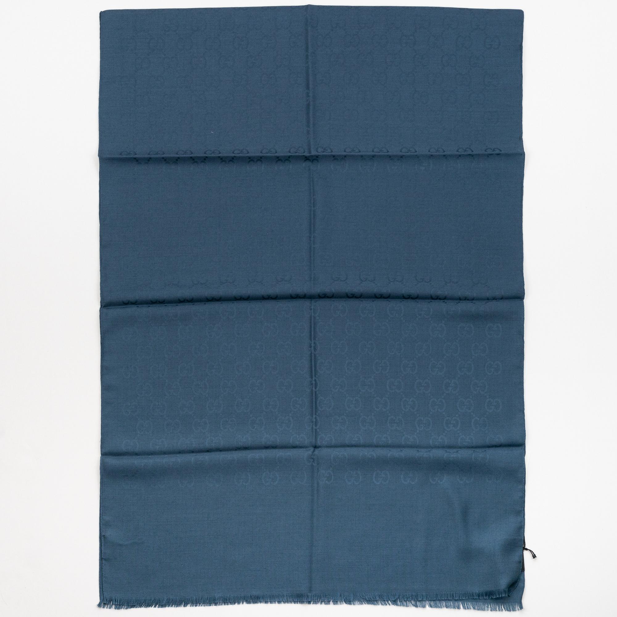 Gucci, a wool and silk mix "GG" jaquard shawl.