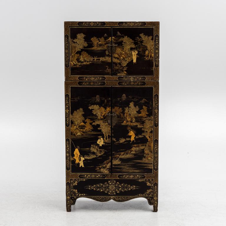 A Chinese lacquered two-part cabinet, first part of the 20th century.